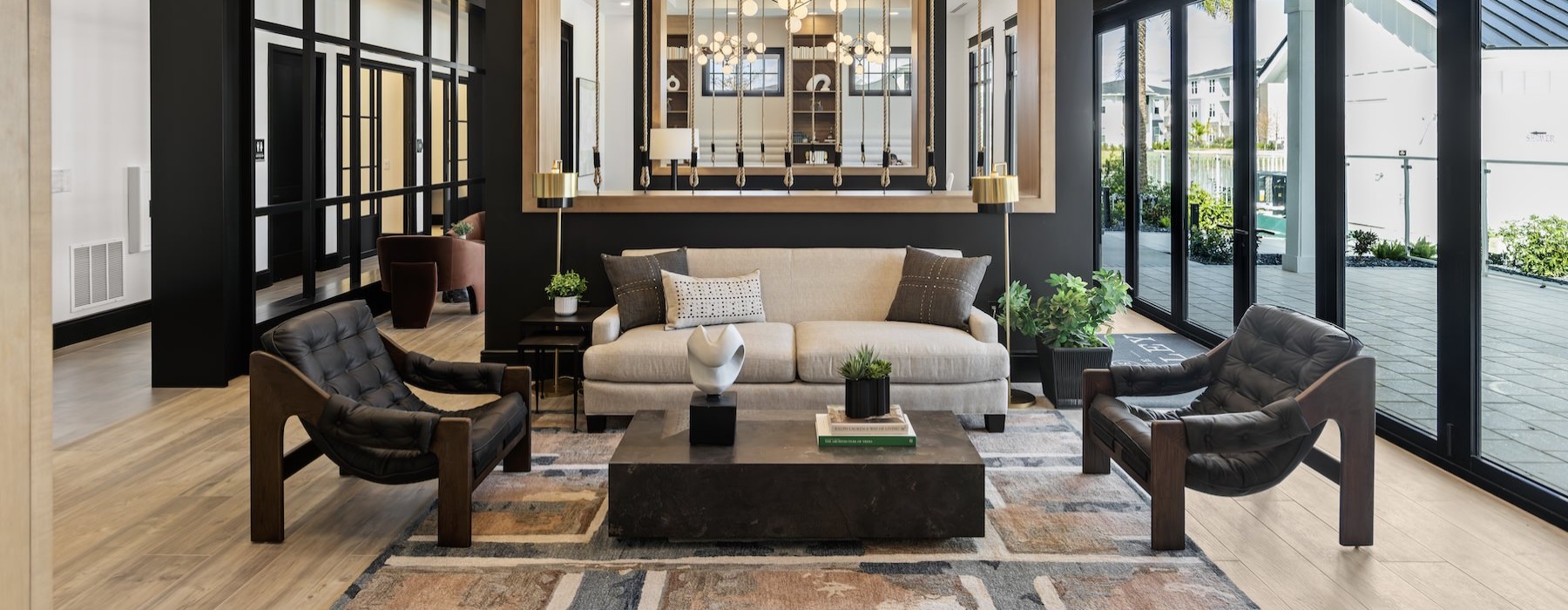 a clubroom with a couch, chairs and a coffee table