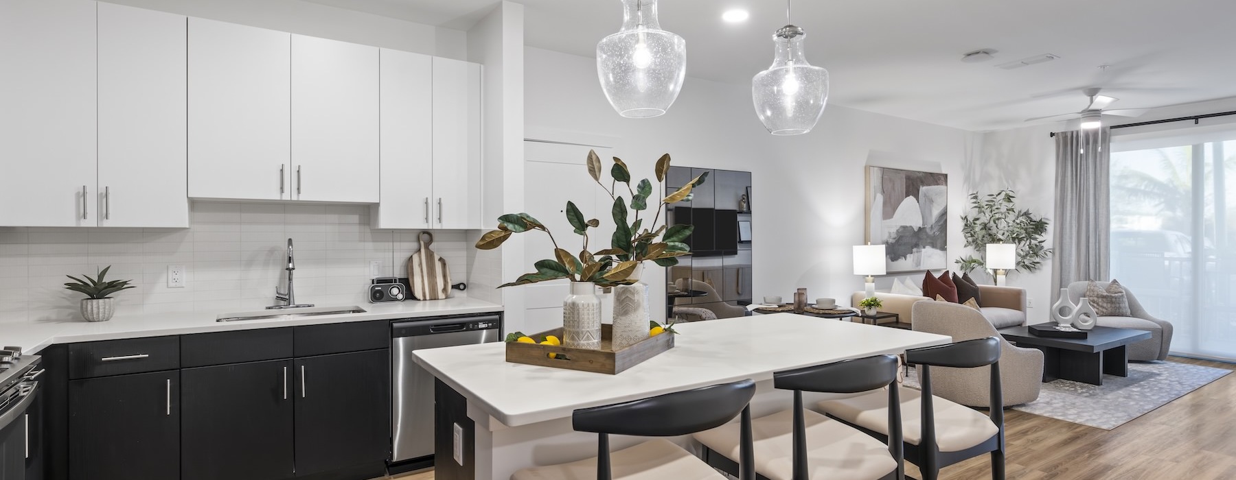 a kitchen with an island and chairs