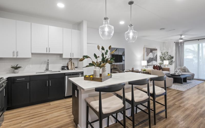 a kitchen with an island and chairs