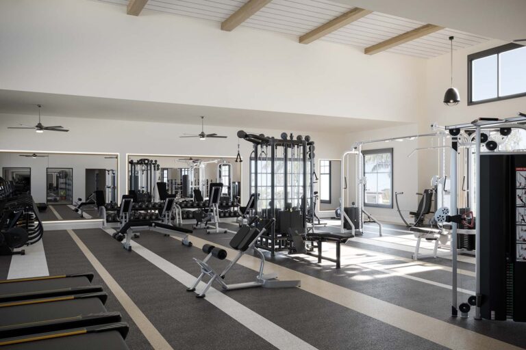 gym room with weights treadmills and bikes for working out